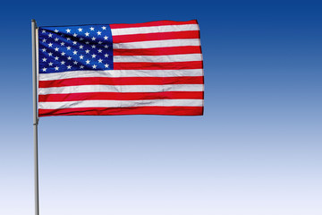 USA Flag on Pole with Blue Background