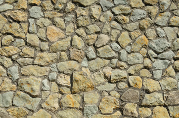 the wall is made of mountain stones