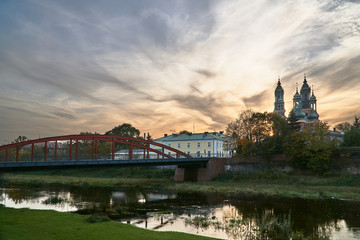 Urban landscape with river Warta and the cathedral towers in autumn in Poznan.