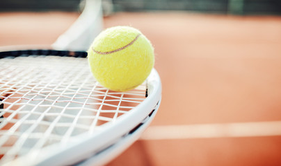 Tennis ball with racket on the tennis court. Sport, recreation concept