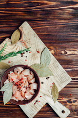 chicken meat chopped on a wooden background on a kitchen board