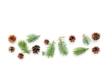 New year symbols pattern. Spruce branches and cones on white background top view copyspace