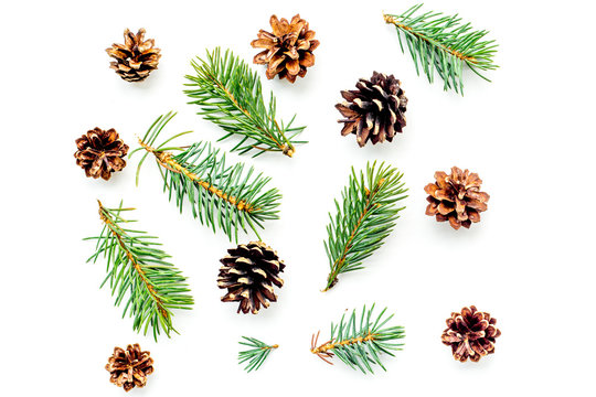 New year symbols pattern. Spruce branches and cones on white background top view