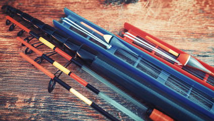 Fishing tackle on a old wooden table. Sport and recreation concept