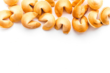 Chinese fortune cookie with prediction on white background top view mock up