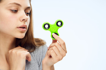 girl mysteriously studying the green spinner