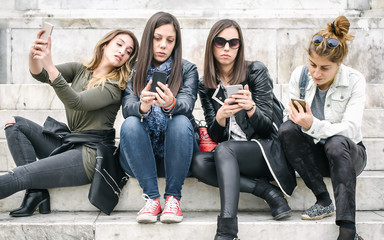 Group of girls with smartphones. Technology isolation and emotional depresion