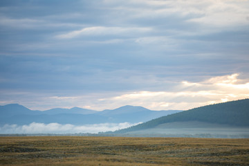 Vast foggy landscape in the northern Mongolia.