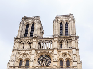 Fototapeta na wymiar Fragmen of facade of Notre Dame Cathedral on Cite Island. Paris, France
