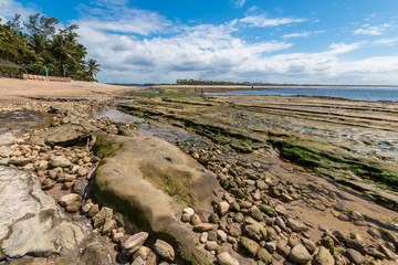 Tropical beach with rocks