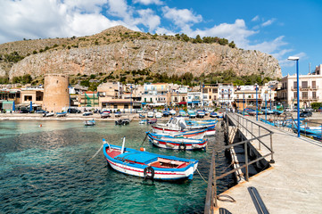 Small port with fishing boats in the center of Mondello, Palermo, Sicily  