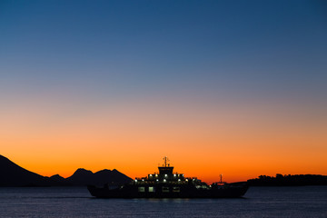 Obraz premium Sunrise over the car ferry