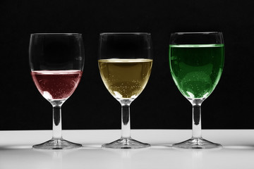 Glasses with colored water growing business chart.