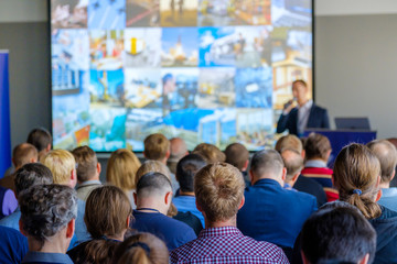 Audience listens to the lecturer at the conference hall