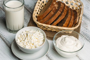 Fresh farm dairy products on wooden background