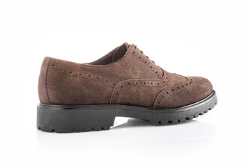 Close up of a brown men's brogues on white background with reflection. Fashion advertising shoes photos.