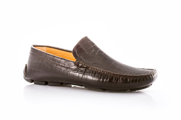 Close up of a brown men's moccasins on white background with reflection. Fashion advertising shoes...