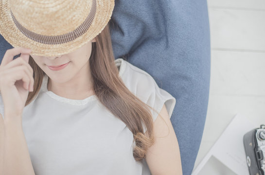 Lovely girl lying on a shofa in white room.