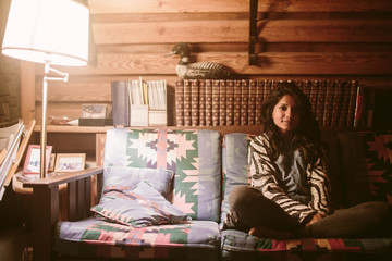 Beautiful Indian woman relaxing in cabin