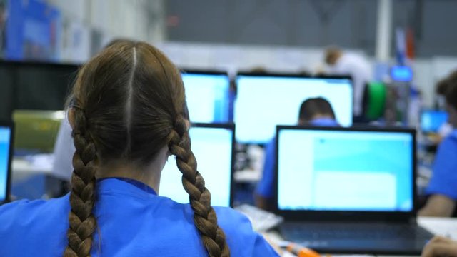 Students prepare a presentation and model 3d program for a 3d printer. The school campus where the instructors do the experiments. School Olympiad for programming, modeling and 3D printing on printer