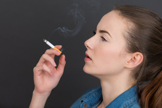 woman smoking slim cigarette