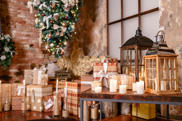 alternative tree upside down on the ceiling. Winter home decor. Christmas in loft interior against brick wall.