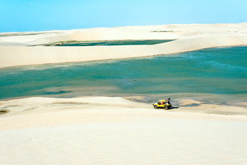 Buggy with tourists traveling through the desert Jericoacoara National Park, Ceara state, Brazil