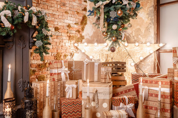 many Christmas gifts. Winter home decor. Christmas in loft interior against brick wall.