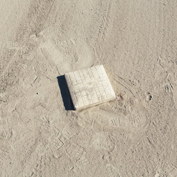 Baseball base and dirt field