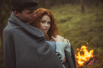 Love story. Couple relaxing in wild forest