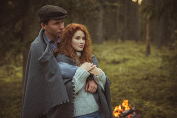 Obraz premium Love story. Couple relaxing in wild forest