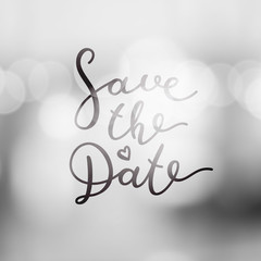 save the date lettering, vector handwritten text on blurred lights