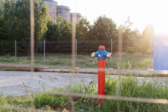 Fire hydrant behind the steel cage fence