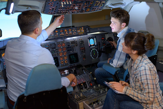 People in aircraft simulator