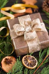 Christmas gift on the antique wooden background.