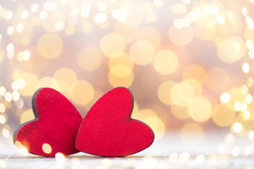 Fototapeta premium Red hearts on the wooden background.