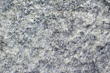 The surface of an old boulder background texture
