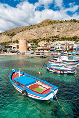 Fototapeta na wymiar Small port with fishing boats in the center of Mondello. 