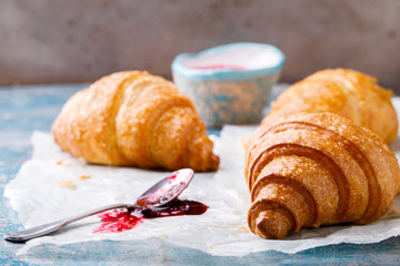  Breakfast Continental  with Fresh  Croissants on a Background of white paper Delicious Baking with Berry Jam