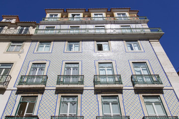 Fototapeta na wymiar Tiled facade of building in Lisbon, Portugal