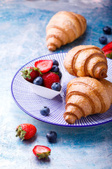 Breakfast Continental  with Fresh  Croissants and ripe Berries .Delicious Baking with Berry Jam