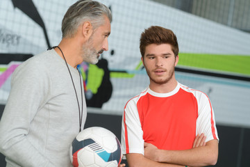 coach and play of football indoor