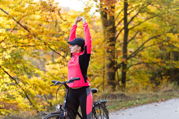 Fototapeta premium Young active sport girl with bicycle outdoor