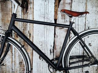 Bicycle detail on the white background, wood