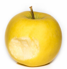 yellow apple with a bite mark on a white background