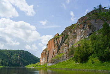 Fototapeta na wymiar Beautifeul mountain river landscape in bright summer day, scenic rock formation on river bank.