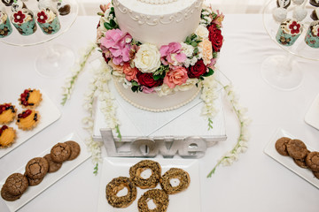 stylish luxury decorated orange candy bar for the celebration of a wedding of happy couple, cathering in the restaurant