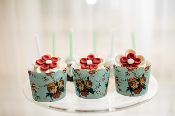 stylish luxury decorated orange candy bar for the celebration of a wedding of happy couple, cathering in the restaurant