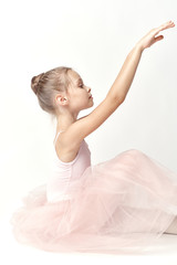 little ballerina dances on a light background, art