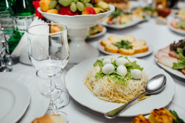 Tasty meat and vegetable snacks on the wedding table